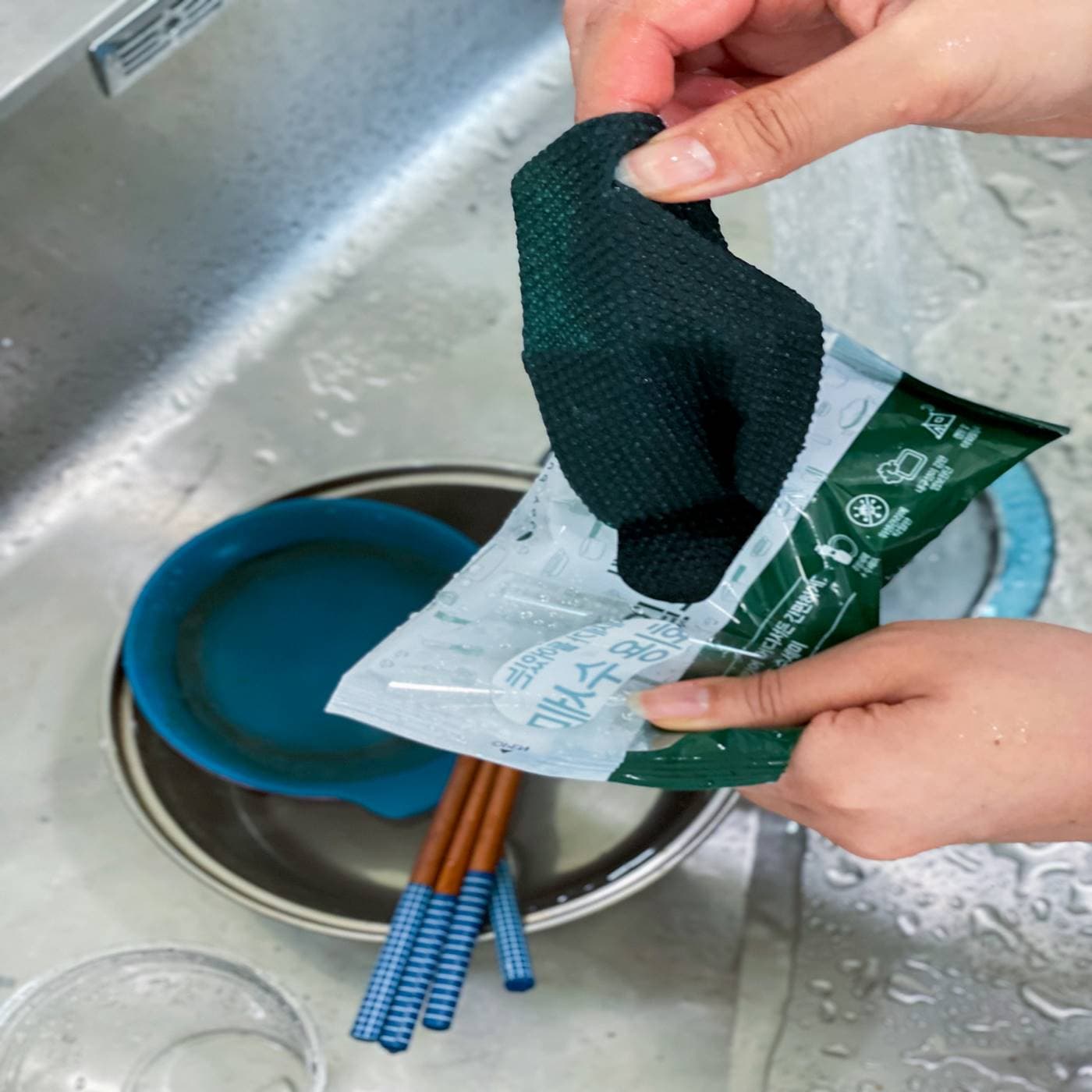 Disposable scouring pad including detergent