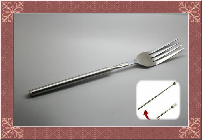 Novelty joke fork with telescopic length