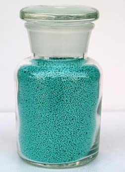 Alkaline protease speckles for detergent powder