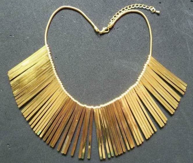 Fashion necklace with hairstick charm in gold plating